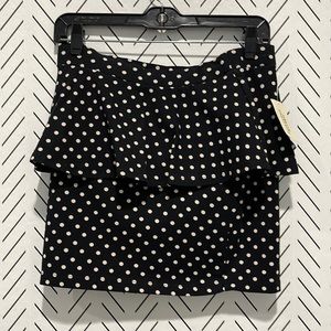 Pocket dot, peplum skirt. Black and white, stretchy. Brand new